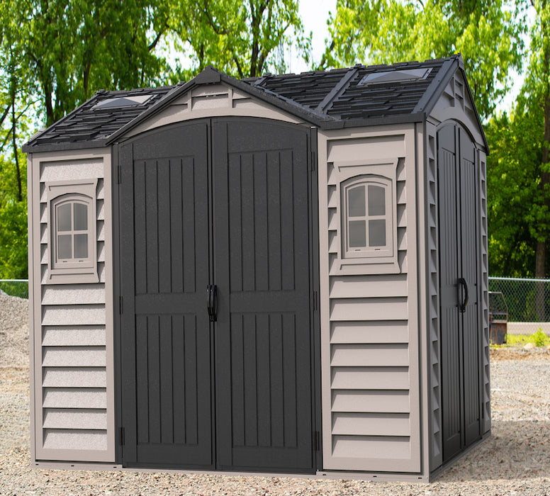 A beige and gray Duramax Apex Pro 10.5'x8' storage shed with double doors and multiple windows.