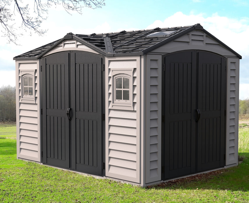 A large Apex Pro 10.5 ft by 8 ft gray plastic storage shed with multiple doors and windows.