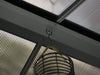 A detailed view of the metal Venus Gazebo's hooks available for hanging lights or other items.