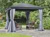 Full view of a 10x10 gazebo with privacy curtains partially drawn back on a garden setting