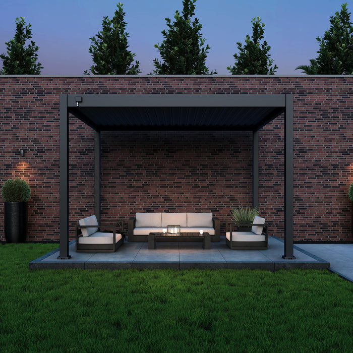 10x12 grand tuscan pergola over outdoor furniture set at night