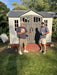 Two men standing in front of an installed Lifetime 10x8 ft. storage shed in a backyard.