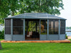 Image of the Freestanding Solarium 12x18 gazebo with a slate metal roof installed in a backyard setting.