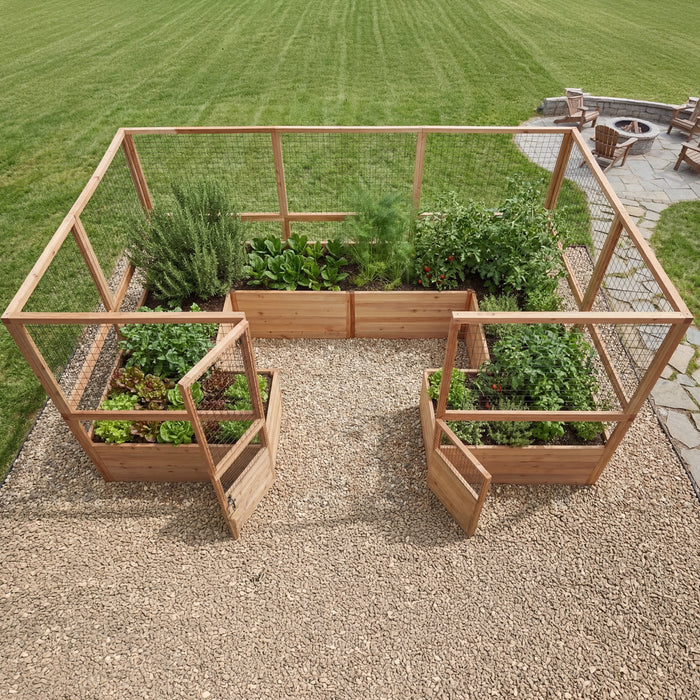 Elevated view of Outdoor Living Today Garden in a Box with Deer Fence showing the U-shaped 12x8 cedar bed layout beside a stone fire pit patio