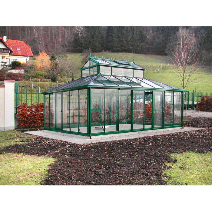 Elegant and stately 15x20 ft cathedral Victorian greenhouse with a large cupola, perched atop a manicured garden path with colorful flowers.