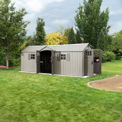 Lifetime 20x8 ft. storage shed with both dual-entry doors open, backyard with trees.
