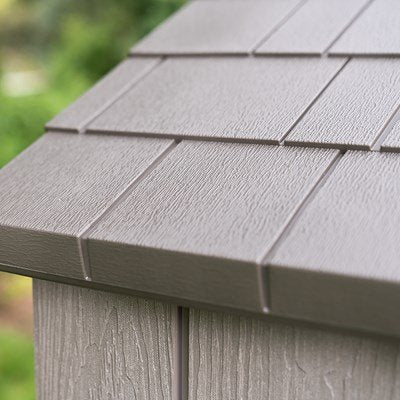 Close-up of the Lifetime storage shed's roof shingle corner detail.