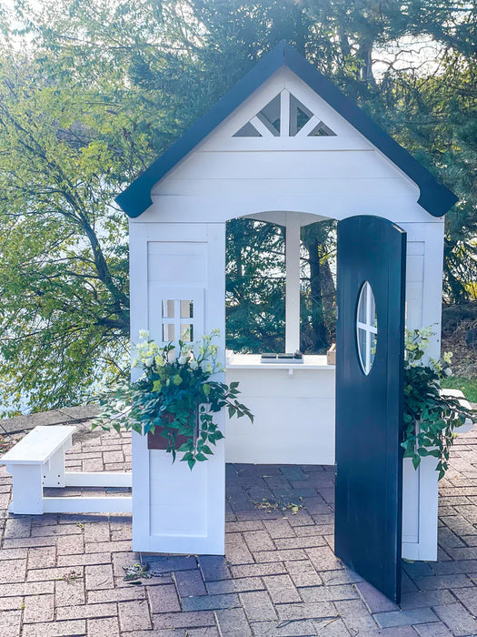 front angle of Zahara Playhouse with door opened outdoors