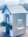 front & side angle of Zahara Playhouse outdoors