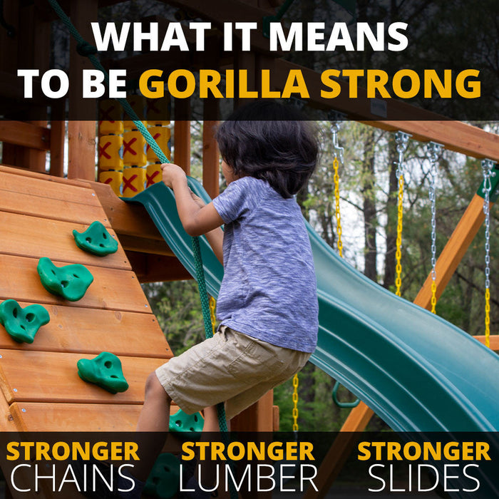 Boy climbing the Nantucket II rock wall showcasing Gorilla Strong features including stronger chains, lumber, and slides for backyard play