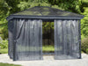 A 10x12 metal gazebo with its privacy curtains fully drawn, creating a closed-off space on a deck next to a pool, with trees in the background.