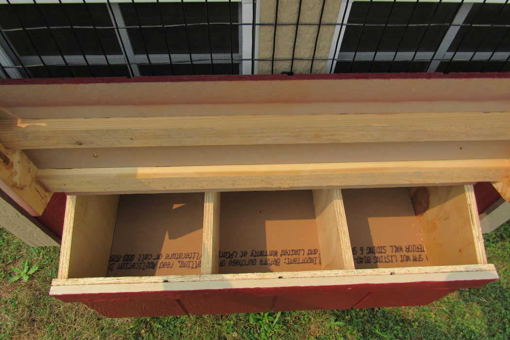 The nesting section of the EZ-Fit 4x6 chicken coop with visible eggs in compartments.