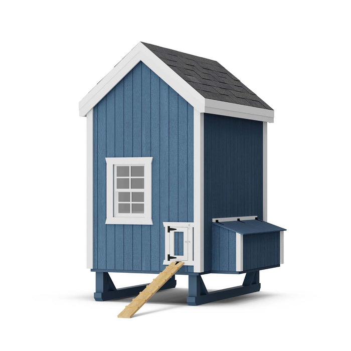 Compact 4x6 Little Cottage Co. Chicken Coop in blue with white trim, showing ramp access and nesting box on elevated wooden base.