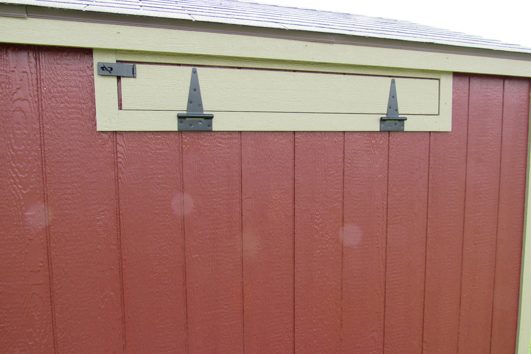 Close-up of a 5x8 portable chicken coop's ventilation system, showing the precision-cut vents and sturdy metal hardware.