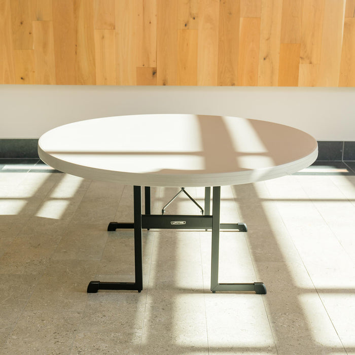 60 inch Lifetime round folding table with sturdy black steel legs set up indoors for meetings, dining, and event seating
