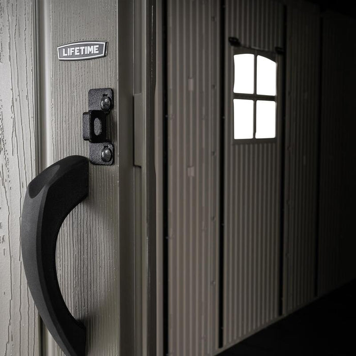 Close-up of the exterior door handle on the Lifetime 8 Ft. x 15 Ft. Outdoor Storage Shed with the brand logo visible.