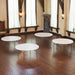 Multiple Lifetime 4 Pack 72in Round Tables arranged indoors for events and banquet setup