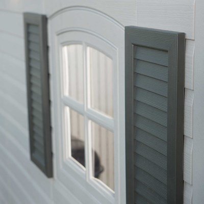 Close-up of the Lifetime storage shed's window and decorative shutters.