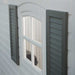 Close-up of the Lifetime storage shed's window and decorative shutters.