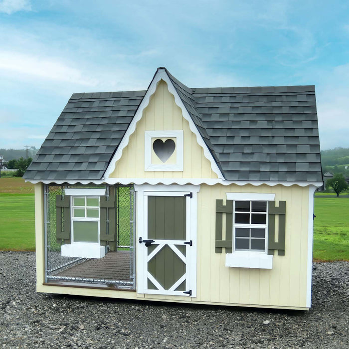 Little Cottage Co. 8x10 Victorian Cozy Kennel displayed outdoors with green shutters and heart-shaped vent