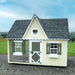 Little Cottage Co. 8x10 Victorian Cozy Kennel displayed outdoors with green shutters and heart-shaped vent