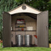 Interior of the Lifetime 8x12.5 ft. storage shed with a tool chest, shelving, and trash cans.