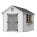 8x12 Colonial Williamsburg shed with clean white siding, gray double barn doors, and accent trim with large window box for colorful plants.