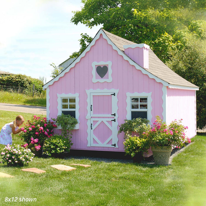 Pink 8x12 Gingerbread Cottage Playhouse by Little Cottage Co. with scalloped trim, white Dutch door, and heart window surrounded by blooming garden.