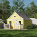 Little Cottage Co. 8x12 Gingerbread Cottage Playhouse in bright yellow with white trim, scalloped edges, heart window, and charming deck and rail design.