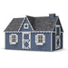 Little Cottage Co. 8x12 Victorian Playhouse in navy blue with white trim and scalloped gable roof, showcasing a heart window and classic barn-style charm.