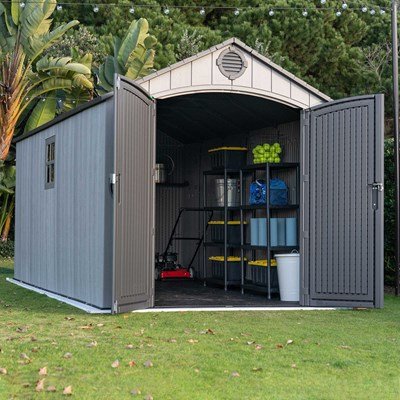 Interior view of the Lifetime 8x15 ft. storage shed with open doors showing shelving, bike, and stored items.