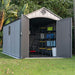 Interior view of the Lifetime 8x15 ft. storage shed with open doors showing shelving, bike, and stored items.