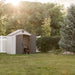 Lifetime 8x5 ft. storage shed in a backyard at golden hour, closed double doors.