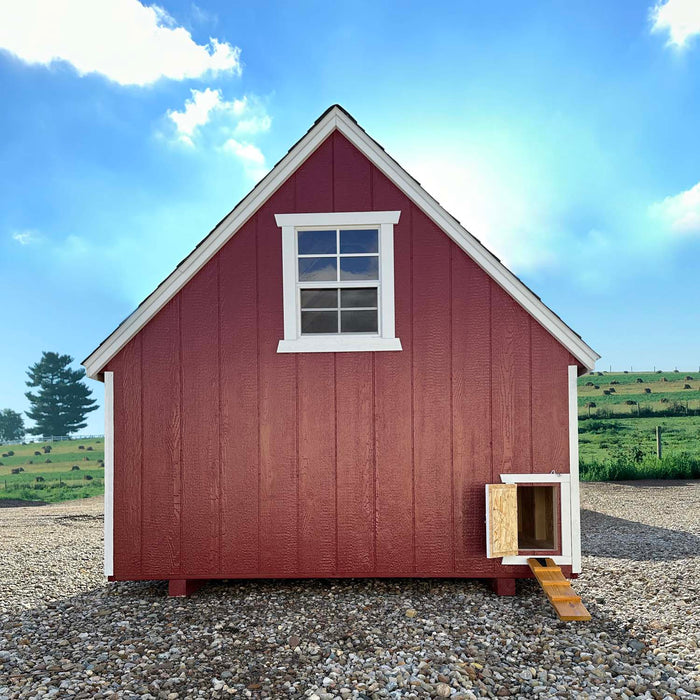 A-frame with open chicken door and ramp on the red coop.