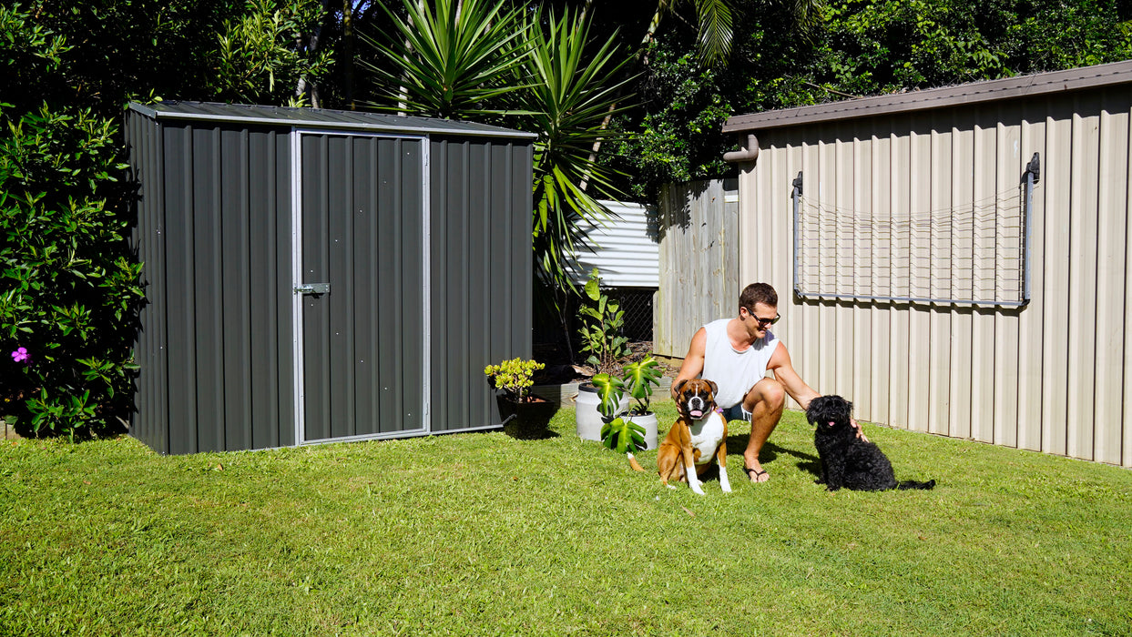 Absco 7' x 3' Space Saver Metal Storage Shed with man and two dogs