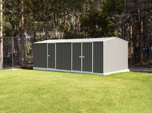 The Absco Workshop Metal 20x10ft shed in a backyard setting.