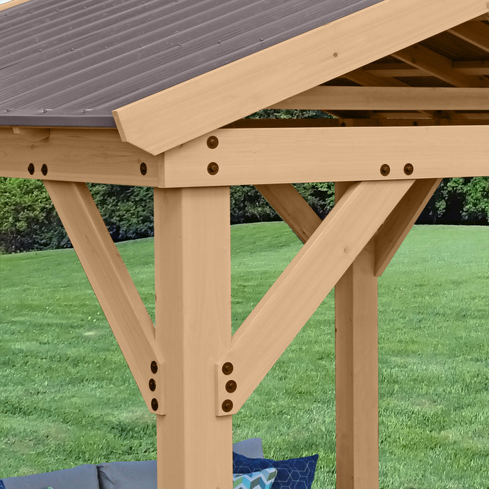 Detailed view of the wooden support beams and aluminum roof of the YM11909 10x10 Yardistry Pavilion.