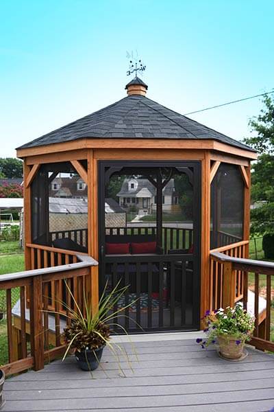 Gazebo-In-A-Box with weathervane on top and screen