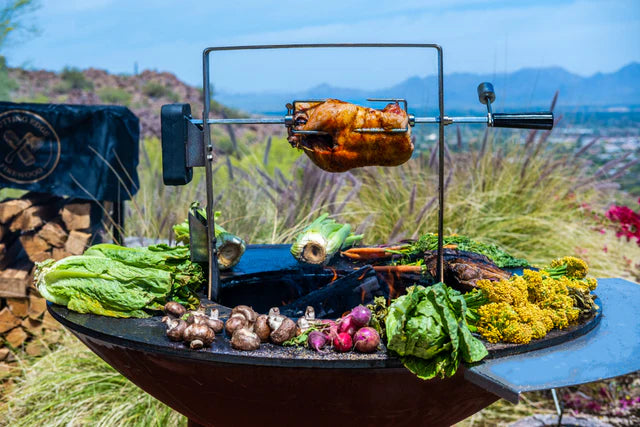 Arteflame Grill with Rotisserie Attachment Cooking Whole Chicken and Vegetables Outdoors