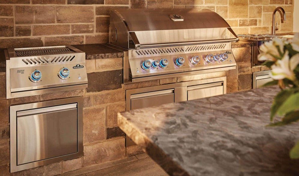 An outdoor kitchen featuring the Napoleon Grills Burner alongside other stainless steel appliances.
