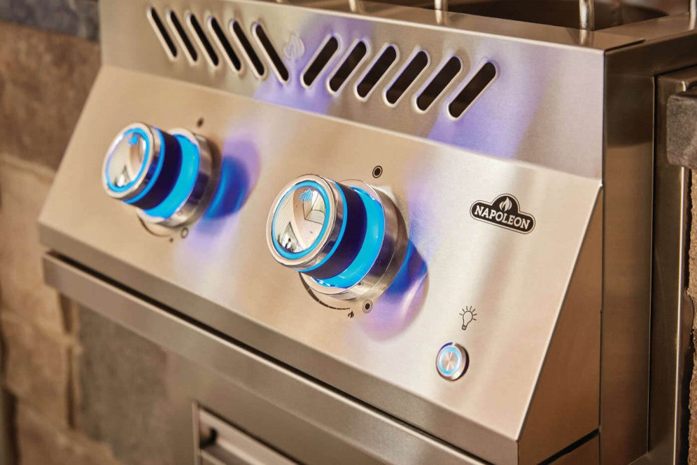 Close-up view of the control knob on the burner with blue illumination