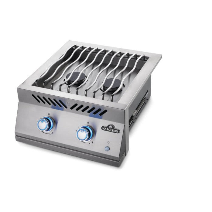 Angled view of the burner and blue-lit control knobs, showcasing the grill's elegant design.