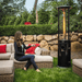 Helios Round Patio Heater being used by a woman