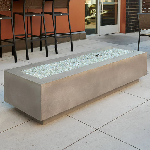The Fire Pit Table unlit, highlighting its shape and metallic base.