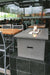 Cinder-colored Solus Firetable at Cactus Club, combining fine dining with contemporary outdoor warmth.