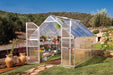 Canopia Essence 8x12 Greenhouse in a frontyard with plants inside.