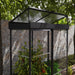 Angled view of the upper lid of Canopia Ivy 4' x 2' Mini Greenhouse, showcasing the clear polycarbonate and black framing.