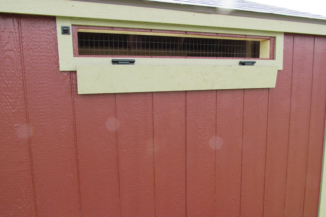 EZ-Fit 5x8 chicken coop featuring a wire mesh window for ventilation, part of the coop's comprehensive design.