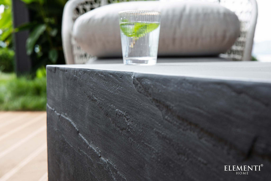 Close-up view of the surface texture on the slate black square medium coffee table from Elementi's Colorado Series.