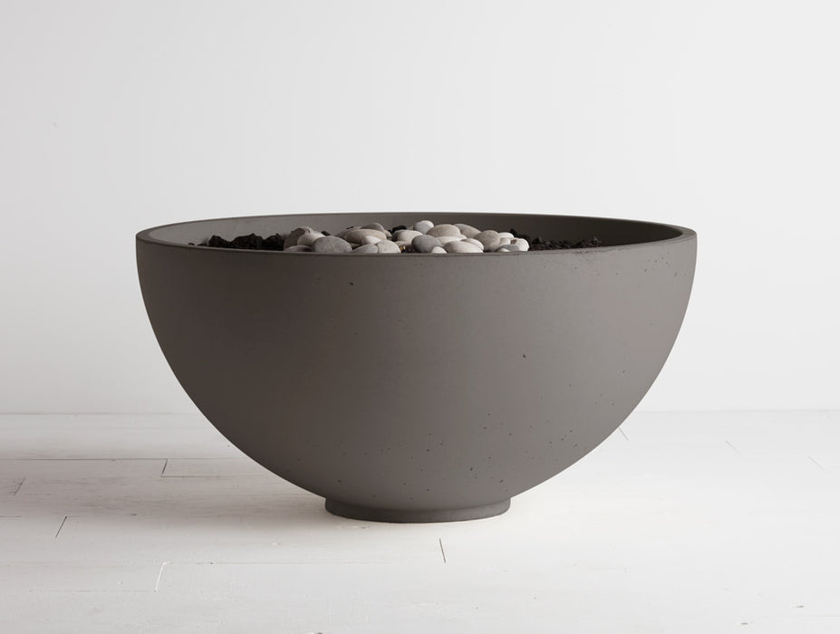 Cinder colored Solus Decor fire pit featuring an adjustable flame in a concrete bowl, ideal for elegant patios.